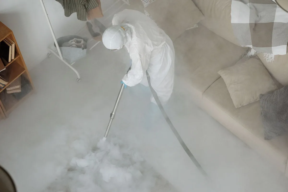 Biohazard cleanup technician in protective equipment, Bayside, New York, NY